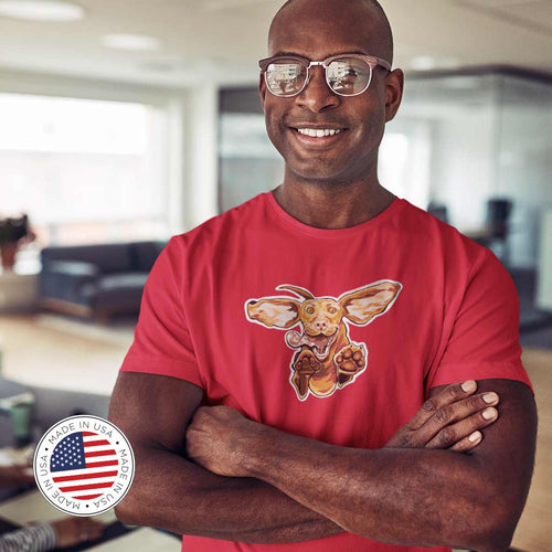 Smiling man with arms crossed in an office wearing a men's red t-shirt featuring our original Hungarian Vizsla dog design on the front. Shirt made in the USA